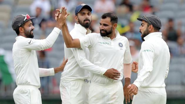 India's Mohammed Shami is congratulated by his teammates after dismissing Australia's Shaun Marsh on day three of the second test match between Australia and India at Perth Stadium. (REUTERS)