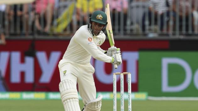 Usman Khawaja plays a coverdrive on day 3 of the Test in Perth. (AP)