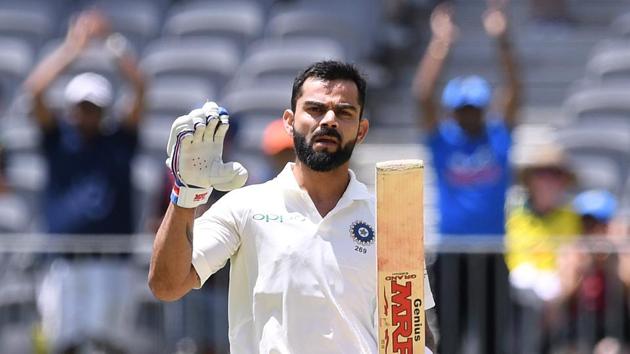 India's captain Virat Kohli reacts after scoring his century on day three of the second test match between Australia and India at Perth Stadium in Perth.(REUTERS)