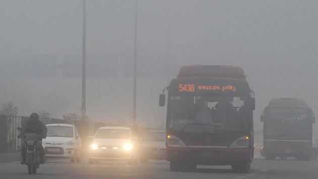 Traffic moves slowly through a dense fog in New Delhi. Image for representation. (AFP file photo) Traffic moves slowly through a dense fog in New Delhi. Image for representation. (AFP file photo)