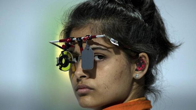 Manu Bhaker of India competes in the shooting 10m air pistol mixed international team event.(AP)