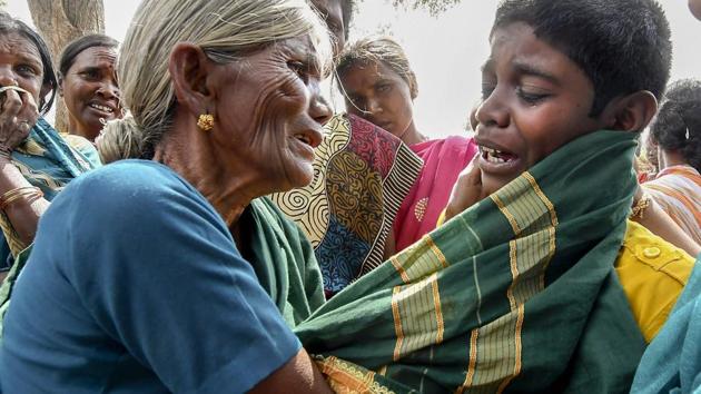 A crying boy being consoled by his grandmother after his mother died of suspected food poisoning at Bidarahalli, near Sulawadi village in Chamarajnagar district of Karnataka state, Saturday, December 15, 2018. (PTI) A crying boy being consoled by his grandmother after his mother died of suspected food poisoning at Bidarahalli, near Sulawadi village in Chamarajnagar district of Karnataka state, Saturday, December 15, 2018. (PTI)