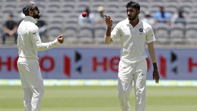 India's skipper Virat Kohli tosses the ball to bowler Jasprit Bumrah. (AP)