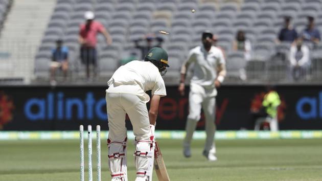 India vs Australia: Australia's Pat Cummins is out, bowled by India's Jasprit Bumrah during play in the second cricket test between Australia and India in Perth, Australia, Monday, Dec. 17, 2018(AP)