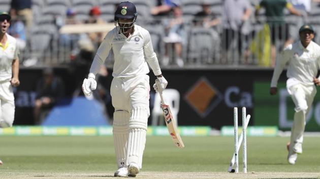 India's KL Rahul walks away from his broken stumps after he is bowled by Australia's Mitchell Starc. (AP)