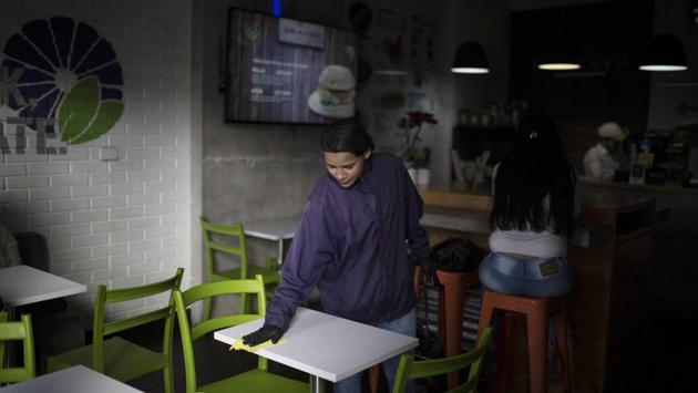 Co-workers at the health foods restaurant in Bogota where Espinoza cleans tables tried to console her, saying the child was simply confused and likely associated the word “mother” with any one of the female neighbours or relatives now helping take care of him. “He would consider that person his mother and not me,” she said, weeping at the memory. (Ivan Valencia / AP) Co-workers at the health foods restaurant in Bogota where Espinoza cleans tables tried to console her, saying the child was simply confused and likely associated the word “mother” with any one of the female neighbours or relatives now helping take care of him. “He would consider that person his mother and not me,” she said, weeping at the memory. (Ivan Valencia / AP)