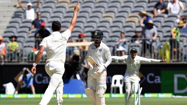 Australia's Mitchell Starc (L) celebrates the dismissal of India's KL Rahul. (AFP) Australia's Mitchell Starc (L) celebrates the dismissal of India's KL Rahul. (AFP)