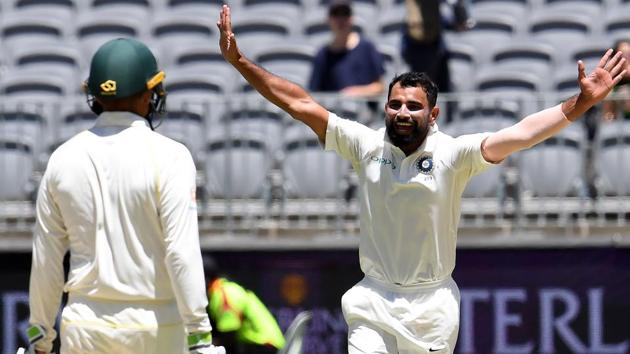 India's paceman Mohammad Shami (R) celebrates the dismissal of Australia's batsman Aaron Finch. (AFP)
