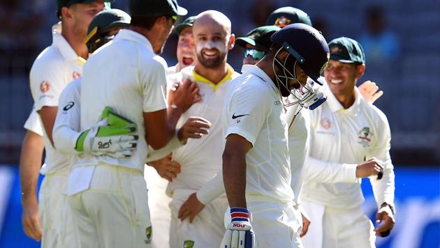 India's Virat Kohli (R) walks back to the pavilion after his dismissal as Australian players celebrate during day four of the second Test cricket match between Australia and India in Perth on December 17, 2018(AFP) India's Virat Kohli (R) walks back to the pavilion after his dismissal as Australian players celebrate during day four of the second Test cricket match between Australia and India in Perth on December 17, 2018(AFP)