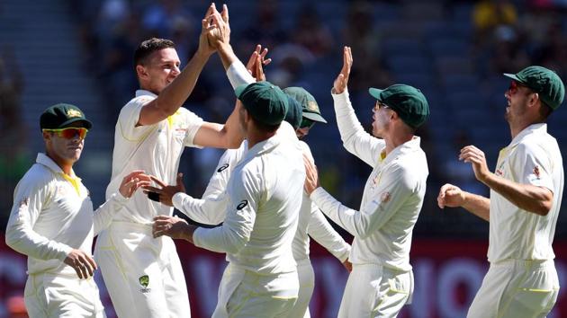 Australia's paceman Josh Hazlewood (2nd L) is congratulated by teammates after dismissing India's Cheteshwar Pujara. (AFP)