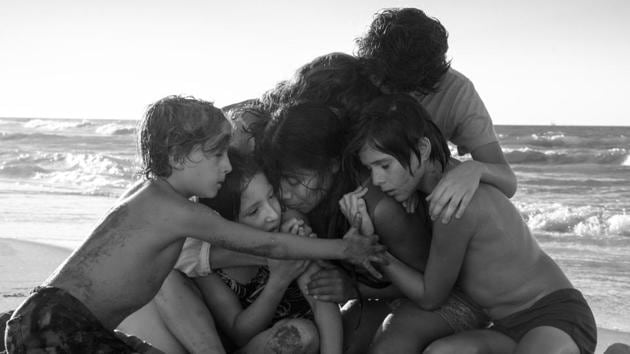 Marco Graf as Pepe, Daniela Demesa as Sofi, Yalitza Aparicio as Cleo, Marina De Tavira as Sofia, Diego Cortina Autrey as To?o, Carlos Peralta Jacobson as Paco in Roma, written and directed by Alfonso Cuarón.(Photo by Carlos Somonte)