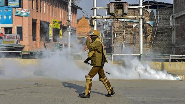 Police personnel use teargas to disperse a protest march led by JKLF chairman Mohammad Yasin Malik (unseen) on the third day of strike, in Srinagar, Monday, Dec. 17, 2018.(PTI Photo)