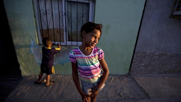 Experts studying migrant families say the same factors typically drive the decision to flee without children, regardless of location: Uncertainty about the journey, worries about job prospects in a new country and a belief that the separation is temporary. A rise in female migration in recent decades has also led to larger numbers of children separated from their mothers. (Fernando Llano / AP) Experts studying migrant families say the same factors typically drive the decision to flee without children, regardless of location: Uncertainty about the journey, worries about job prospects in a new country and a belief that the separation is temporary. A rise in female migration in recent decades has also led to larger numbers of children separated from their mothers. (Fernando Llano / AP)