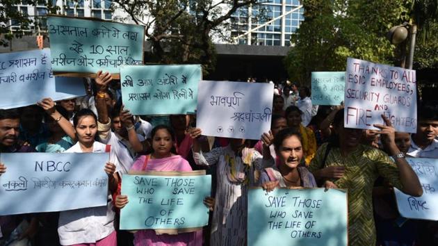 The death toll in Mumbai’s hospital fire shot up to eight, while another 147, mostly patients and staff, were rescued from a massive blaze that engulfed the Employees State Insurance Corporation (ESIC) Hospital in Andheri (East) on Monday. The staff is seen protesting against government as well as NBCC outside the hospital at MIDC Marol, Andheri. (Satyabrata Tripathy / HT Photo) The death toll in Mumbai’s hospital fire shot up to eight, while another 147, mostly patients and staff, were rescued from a massive blaze that engulfed the Employees State Insurance Corporation (ESIC) Hospital in Andheri (East) on Monday. The staff is seen protesting against government as well as NBCC outside the hospital at MIDC Marol, Andheri. (Satyabrata Tripathy / HT Photo)