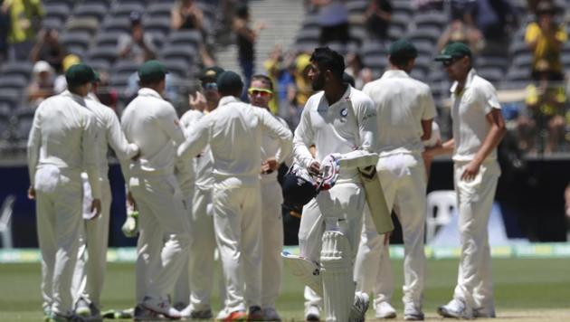India's Jasprit Bumrah walks off as Australian players celebrate winning the second cricket test between Australia and India in Perth, Australia, Tuesday, Dec. 18, 2018(AP)
