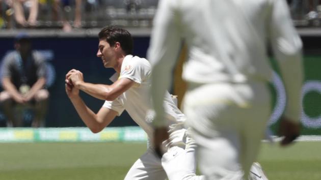 Australia's Pat Cummins takes a catch to dismiss India's Jasprit Bumrah, India's last wicket giving Australia the win the second cricket test in Perth, (AP)