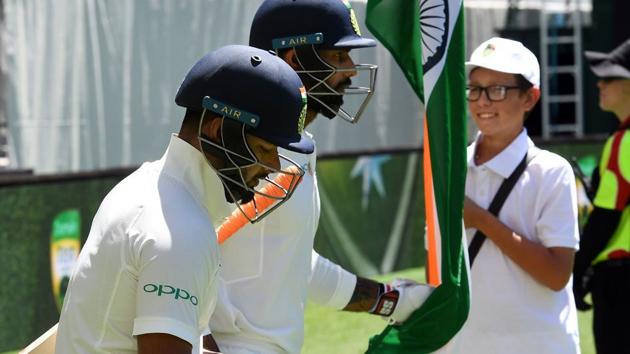 Indian batsmen Rishabh Pant (L) and Hanuma Vihari walk out to bat during day five of the second cricket match between Australia and India in Perth. (AFP)