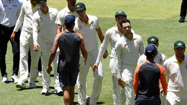 India's captian Virat Kohli (C) shakes hands with Australian players at the end of second Test cricket match between Australia and India in Perth. (AFP)