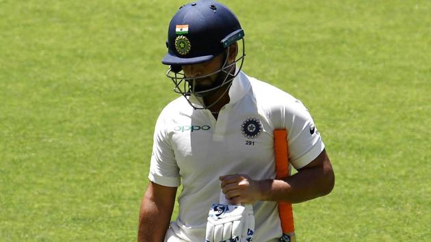 India's batsman Rishabh Pant walks back to the pavilion after his dismissal during day five of the second Test cricket match between Australia and India in Perth. (AFP)