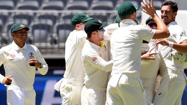 Australia's paceman Mitchell Starc (R) celebrates with teammates the dismissal of India's batsman Hanuma Vihari during day five of the second Test cricket match between Australia and India in Perth. (AFP)