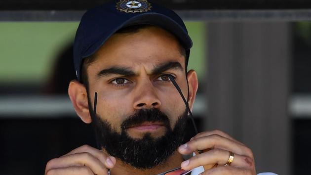 India's captain Virat Kohli (C) sits on the players bench at the end of second Test cricket match between Australia and India in Perth.(AFP)