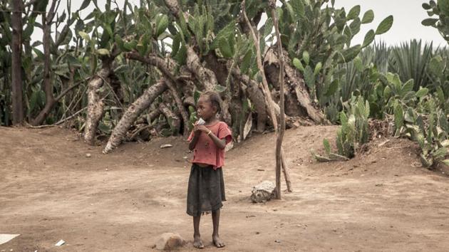 A girl eats a food supplement. Even on an empty stomach, Vatofara will vote Wednesday for the second round of the presidential election. “I hope the next president will help us a little more,” she said. For several seasons now, southern Madagascar has been caught up in a drought that has made water scarce, wrecking even efforts to grow rice -- the staple food. (Rijasolo / AFP) A girl eats a food supplement. Even on an empty stomach, Vatofara will vote Wednesday for the second round of the presidential election. “I hope the next president will help us a little more,” she said. For several seasons now, southern Madagascar has been caught up in a drought that has made water scarce, wrecking even efforts to grow rice -- the staple food. (Rijasolo / AFP)