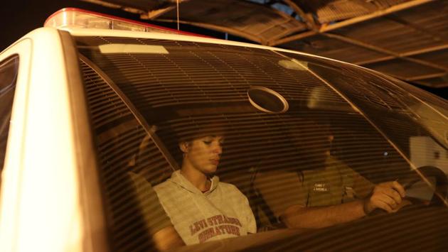 Mislady Herrera who was detained by the police is transported to an immigration office. The country is hardening its stance towards immigration, and refused to sign a United Nations migration pact last week aimed at improving migrant integration and protection. (Ivan Alvarado / REUTERS)