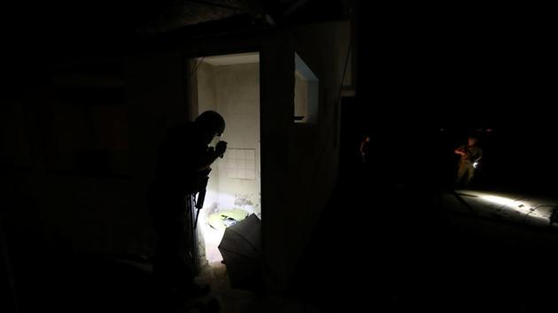 Policemen inspect an empty building used by migrants to shelter themselves after avoiding frontier check points. There has also been a spike in illegal migration. In the dusty Arica region at Peru’s southern border, Chilean police say they caught more than 2,200 foreigners attempting to enter the country illegally between January and November, up 80% from last year. (Ivan Alvarado / REUTERS)