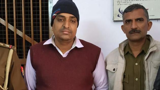 The principal of Noida’s New K M Public School, Sanjiv Jha (in cap) was arrested on Tuesday, December 18, 2018. (HT Photo) The principal of Noida’s New K M Public School, Sanjiv Jha (in cap) was arrested on Tuesday, December 18, 2018. (HT Photo)