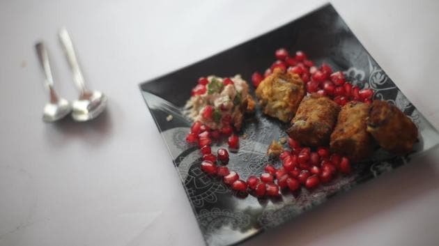 Spring rolls served with cole slaw and pomegranate 