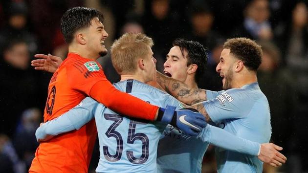 Manchester City's Oleksandr Zinchenko celebrates with team mates after scoring the winning penalty during the shoot-out. (REUTERS) Manchester City's Oleksandr Zinchenko celebrates with team mates after scoring the winning penalty during the shoot-out. (REUTERS)
