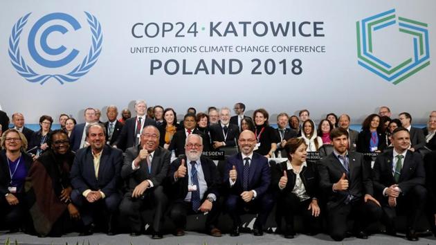 COP24 President Michal Kurtyka and Executive Secretary of the UN Framework Convention on Climate Change Patricia Espinosa pose with the heads of delegations after adopting the final agreement during a closing session of the COP24 UN Climate Change Conference 2018, Katowice, Poland, December 15(REUTERS)