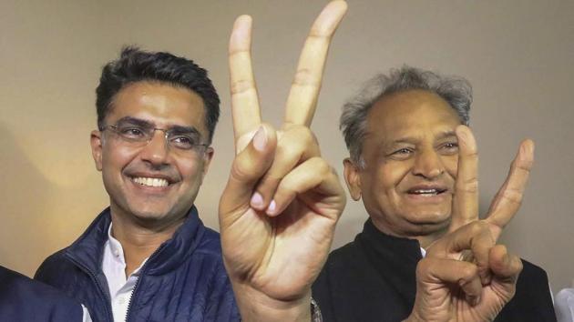 Rajasthan chief minsiter Ashok Gehlot (R) and his deputy Sachin Pilot (C in Jaipur.(PTI)