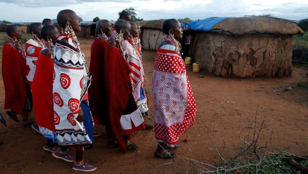 Maasai women walk within the Mbirikani Manyatta at the base of Mt. Kilimanjaro. “We are trying to educate and emphasise that it’s not the right way to go because we treasure these wild animals, it’s part of our heritage, it’s part of our culture,” Rudisha said. (Thomas Mukoya / Reuters) Maasai women walk within the Mbirikani Manyatta at the base of Mt. Kilimanjaro. “We are trying to educate and emphasise that it’s not the right way to go because we treasure these wild animals, it’s part of our heritage, it’s part of our culture,” Rudisha said. (Thomas Mukoya / Reuters)