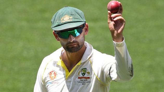 Australia's Nathan Lyon shows the ball as he leaves the field following his 6 wicket haul on day four of the first test match between Australia and India at the Adelaide Oval in Adelaide, Australia, December 9, 2018.(REUTERS)