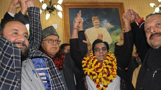 Former BJP MLA Gagan Bhagat with Farooq Abdullah after he joined National Conference in Jammu on Thursday.(PTI)