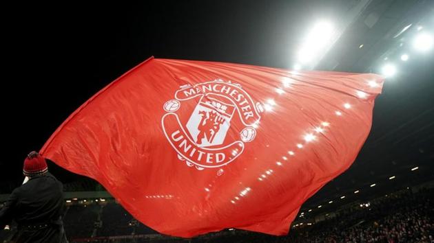 Soccer Football - Champions League Round of 16 Second Leg - Manchester United vs Sevilla - Old Trafford, Manchester, Britain - March 13, 2018 A Manchester United flag is waved before the match (REUTERS) Soccer Football - Champions League Round of 16 Second Leg - Manchester United vs Sevilla - Old Trafford, Manchester, Britain - March 13, 2018 A Manchester United flag is waved before the match (REUTERS)