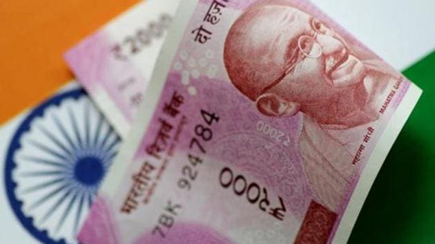 A rupee note is seen in this illustration. Image for representation. (Reuters file photo) A rupee note is seen in this illustration. Image for representation. (Reuters file photo)