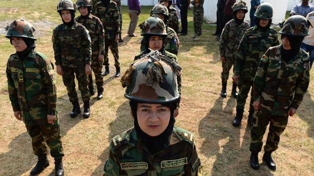 Afghan women army cadets stand in formation during a practice session. Jaswal, acting as an interpreter for a majority of the women officers who know only Pashto and Dari said that the weather was the major a hurdle faced by these cadets as the present temperature in their country is below 5 degree Celsius. (Arun Sankar / AFP) Afghan women army cadets stand in formation during a practice session. Jaswal, acting as an interpreter for a majority of the women officers who know only Pashto and Dari said that the weather was the major a hurdle faced by these cadets as the present temperature in their country is below 5 degree Celsius. (Arun Sankar / AFP)