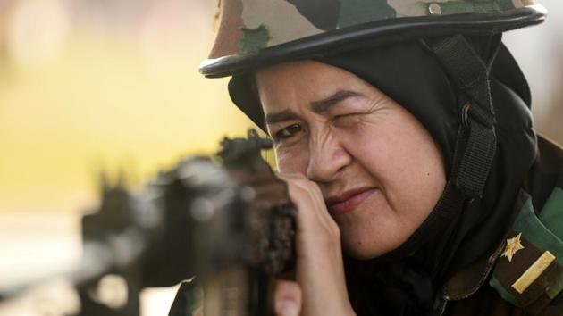 Headscarf clad, an Afghan army cadet shows steely focus as she handles the machine gun with the ease of a professional during a training session at the shooting range of the Officers Training Academy (OTA) in Chennai, Tamil Nadu. (Arun Sankar / AFP) Headscarf clad, an Afghan army cadet shows steely focus as she handles the machine gun with the ease of a professional during a training session at the shooting range of the Officers Training Academy (OTA) in Chennai, Tamil Nadu. (Arun Sankar / AFP)