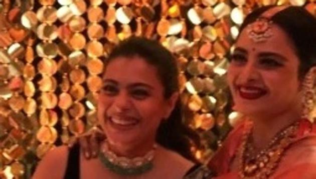 Kajol and Rekha pose for pictures at Priyanka Chopra’s wedding reception in Mumbai on Thursday.(Instagram)