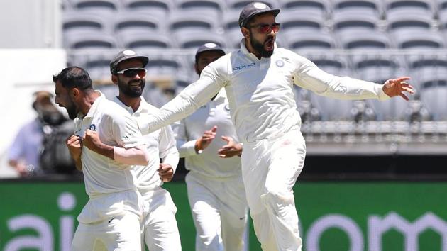 India's captain Virat Kohli (R) reacts after his teammate Mohammed Shami (L) dismissed Australia's Aaron Finch. (REUTERS) India's captain Virat Kohli (R) reacts after his teammate Mohammed Shami (L) dismissed Australia's Aaron Finch. (REUTERS)