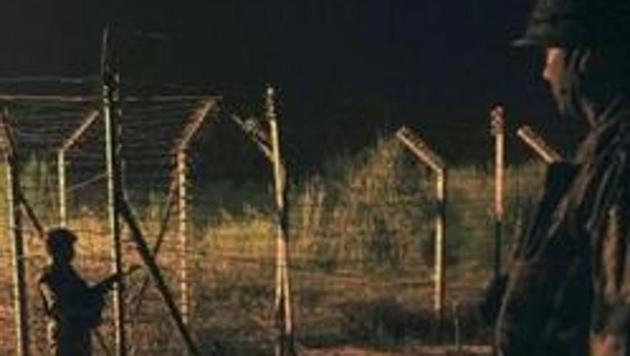 Soldiers standing guard during a night patrol near the fence at the India-Pakistan International Border at the outpost of Akhnoor sector. (HT File Photo/Representative image) Soldiers standing guard during a night patrol near the fence at the India-Pakistan International Border at the outpost of Akhnoor sector. (HT File Photo/Representative image)