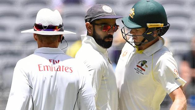 India's captain Virat Kohli (C) and Australia's captain Tim Paine react after Paine ran a single.(REUTERS)