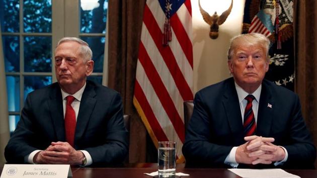U.S. President Donald Trump speaks to the news media while gathering for a briefing from his senior military leaders, including Defense Secretary James Mattis (L), in the Cabinet Room at the White House.(REUTERS)