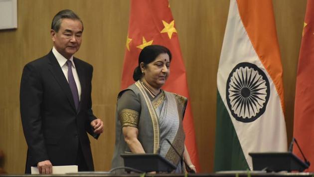 The foreign ministers of India and China on Friday discussed steps to deepen ties through academic exchanges and tourism even as they vie for influence with their smaller neighbours. Sushma Swaraj and Wang Yi at their meeting in New Delhi took up enhancing cooperation in tourism, art, film, media, culture, yoga, sports, academic and youth exchanges, according to a tweet from India’s External Affairs Ministry spokesman Raveesh Kumar. (Vipin Kumar / HT Photo)
