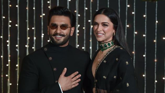 Ranveer Singh and Deepika Padukone pose as they arrive to attend wedding reception of Priyanka Chopra and Nick Jonas in Mumbai on December 20, 2018.(AFP)