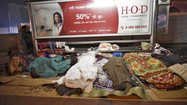 While most shelters are not at capacity yet, those at AIIMS are filled with a large number sleeping on the streets. With no space, people are sleeping in the AIIMS subway. The government’s weather forecasting agency has issued a warning of cold wave conditions over the next few days. Most homeless are migrants who come seeking a livelihood or are outstation patients at hospitals. (Burhaan Kinu / HT Photo) While most shelters are not at capacity yet, those at AIIMS are filled with a large number sleeping on the streets. With no space, people are sleeping in the AIIMS subway. The government’s weather forecasting agency has issued a warning of cold wave conditions over the next few days. Most homeless are migrants who come seeking a livelihood or are outstation patients at hospitals. (Burhaan Kinu / HT Photo)