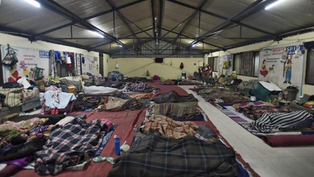 As Delhi’s temperature plummets to a bone-chilling 4 degrees Celsius, the city’s homeless are sheltering in structures like this one at Sarai Kale Khan, one of the city’s 248 night shelters. Of these, 83 are permanent buildings, 115 are porta cabins while 45 are makeshift tents. The capital’s Delhi Urban Shelter Improvement Board (DUSIB) is tasked with providing a stay to over 17,000 homeless people. (Burhaan Kinu / HT Photo) As Delhi’s temperature plummets to a bone-chilling 4 degrees Celsius, the city’s homeless are sheltering in structures like this one at Sarai Kale Khan, one of the city’s 248 night shelters. Of these, 83 are permanent buildings, 115 are porta cabins while 45 are makeshift tents. The capital’s Delhi Urban Shelter Improvement Board (DUSIB) is tasked with providing a stay to over 17,000 homeless people. (Burhaan Kinu / HT Photo)