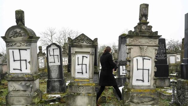 Jewish headstones tagged with swastika symbols at Herrlisheim cemetery, in eastern France. 37 headstones and a memorial for Shoah victims were desecrated. (Sebastien Bozon / AFP) 